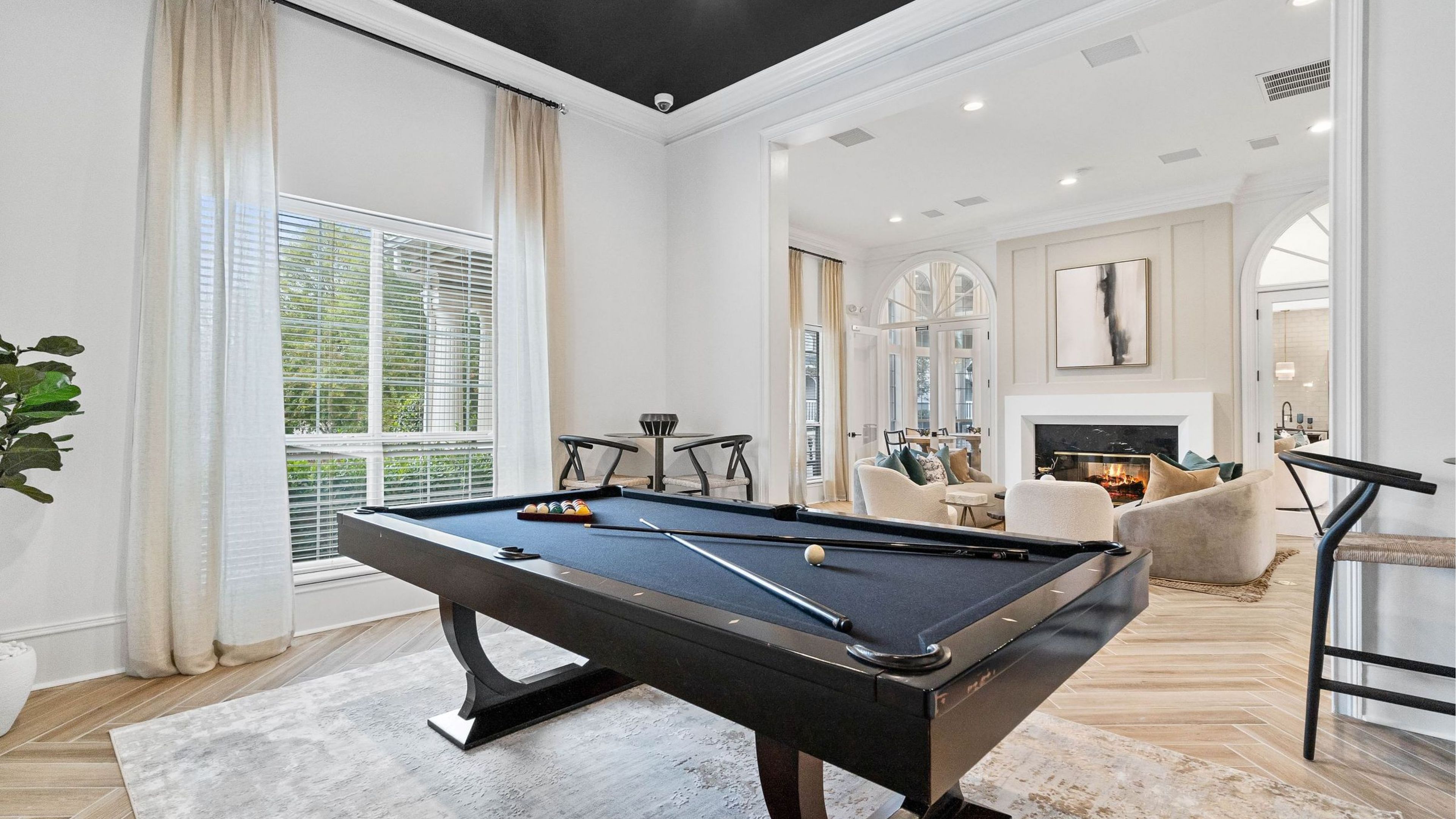 Hawthorne at the Carlyle resident clubhouse game room with a large billiards table.