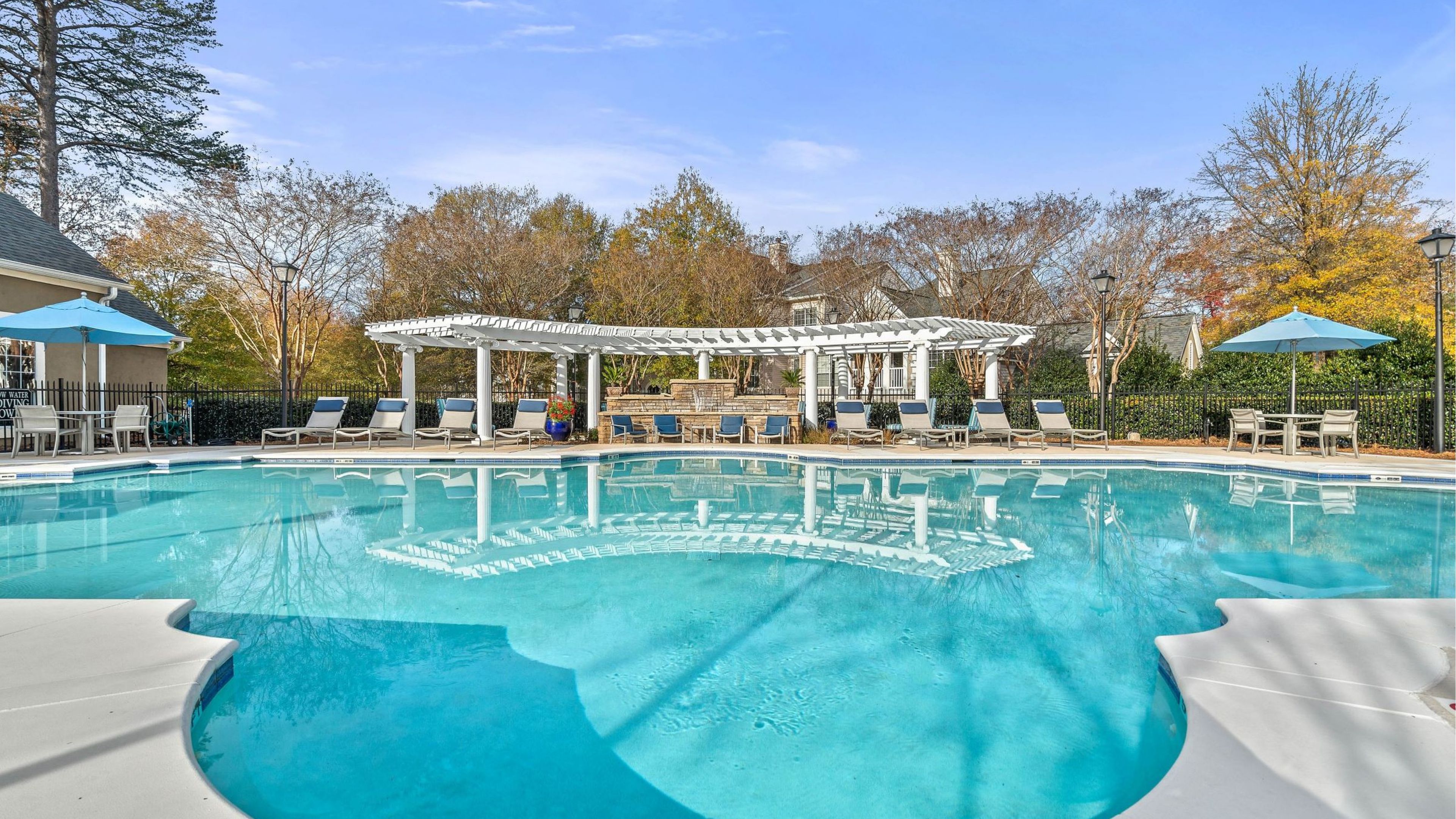 Hawthorne at the Carlyle large pool amenity bordered by lounge chairs.